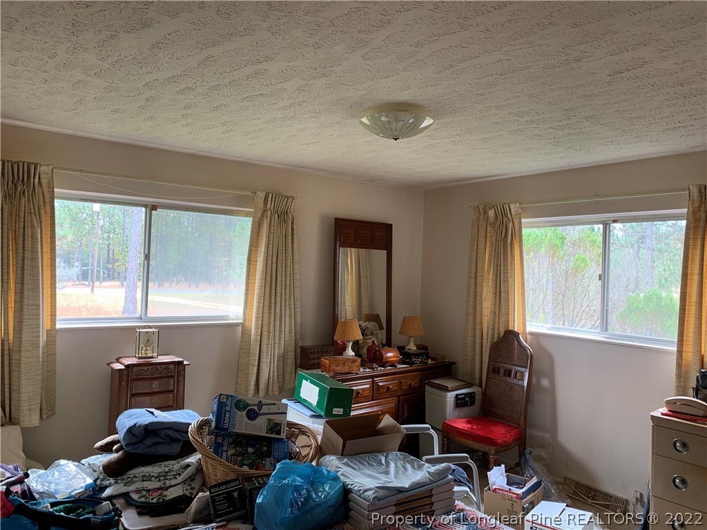350 Horseshoe Road Aberdeen, NC 28315 - Photo 29 of 47 a room with furniture toys and a window