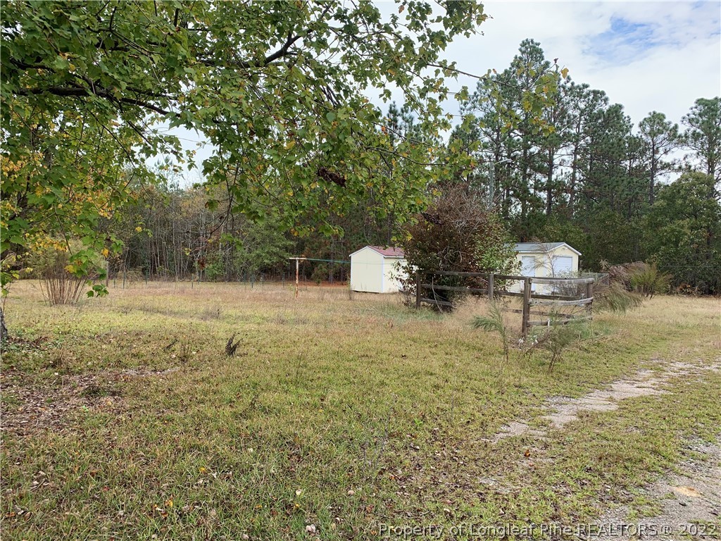 350 Horseshoe Road Aberdeen, NC 28315 - Photo 44 of 47 a view of a house with a yard