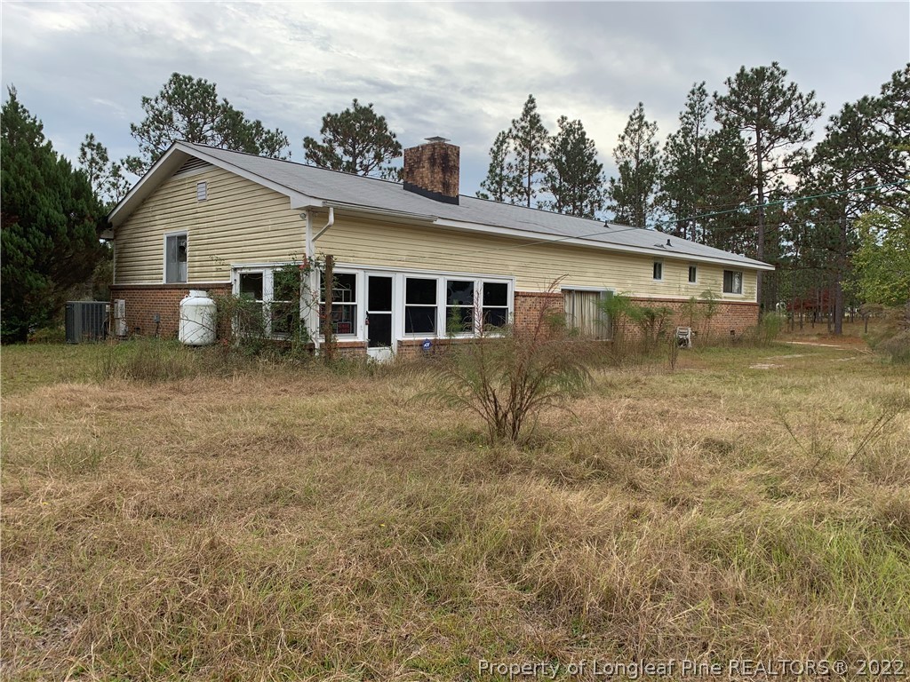 350 Horseshoe Road Aberdeen, NC 28315 - Photo 45 of 47 a view of a house with a yard