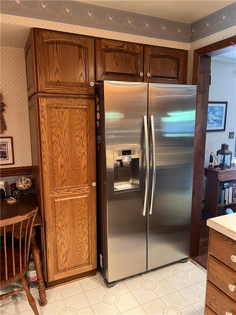 6830 Gun Club Road Coopersburg, PA 18036 - Photo 16 of 30 Ample cabinetry complements a sleek stainless steel refrigerator in this functional kitchen corner.