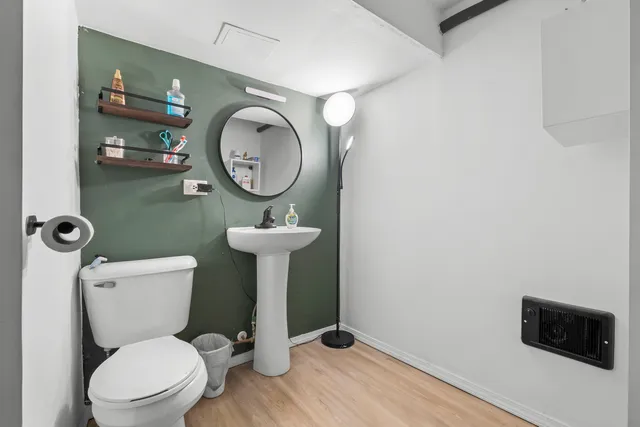 a view of empty room with a refrigerator and window
