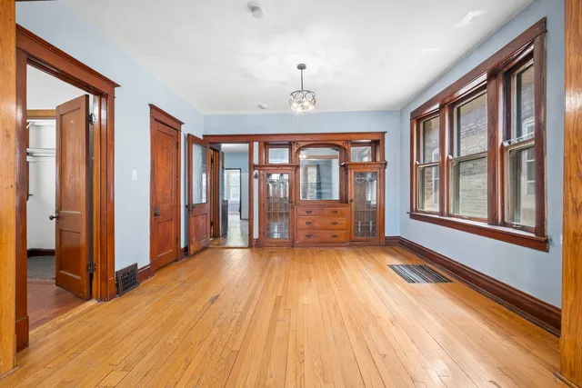 a view of an entryway with wooden floor and door