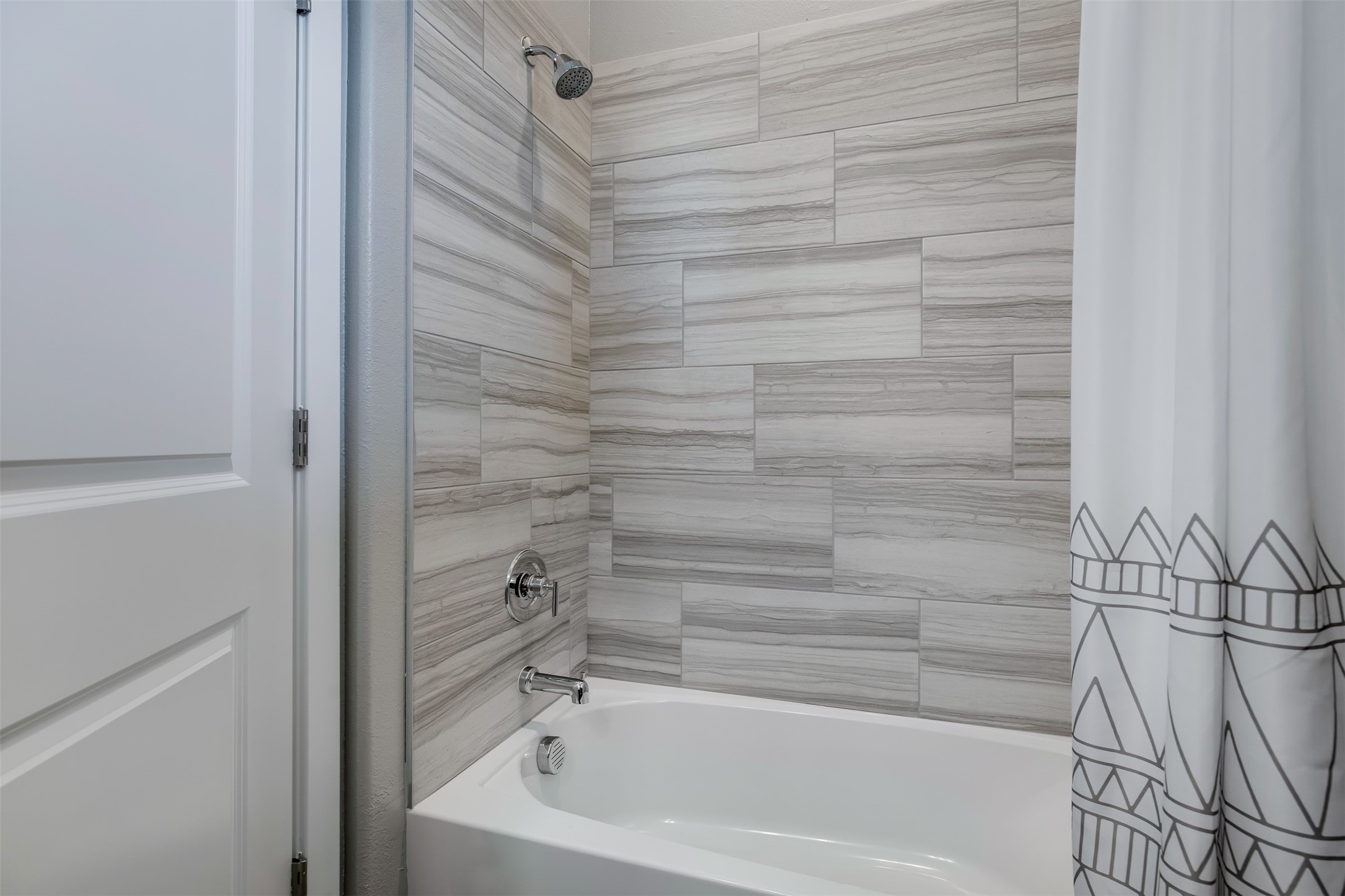 7157 Rustle Road Fort Worth, TX 76123 - Photo 17 of 38 a bathroom with a bathtub