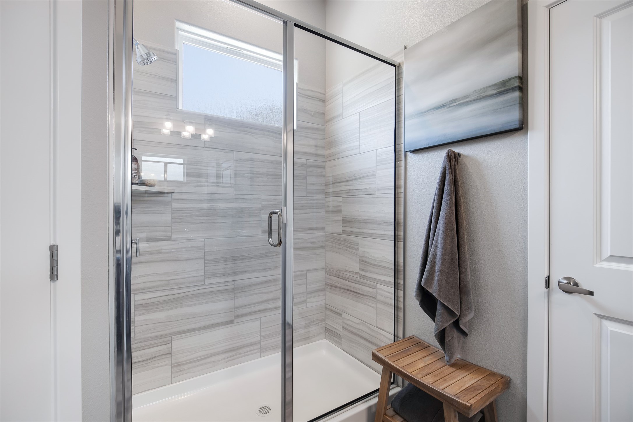 7157 Rustle Road Fort Worth, TX 76123 - Photo 21 of 38 a bathroom with a shower and a glass door