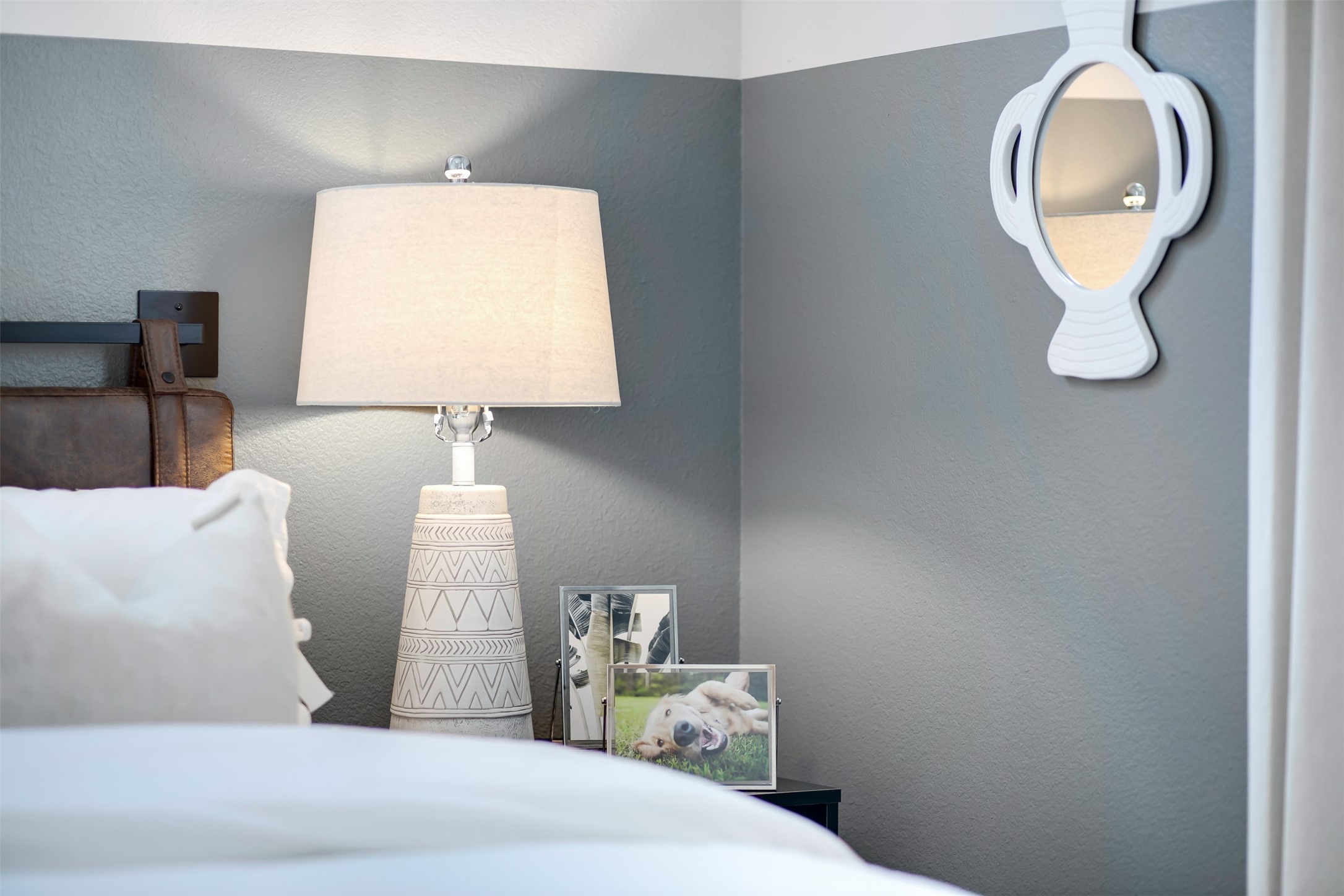 7157 Rustle Road Fort Worth, TX 76123 - Photo 26 of 38 a bedroom with a bed and a lamp