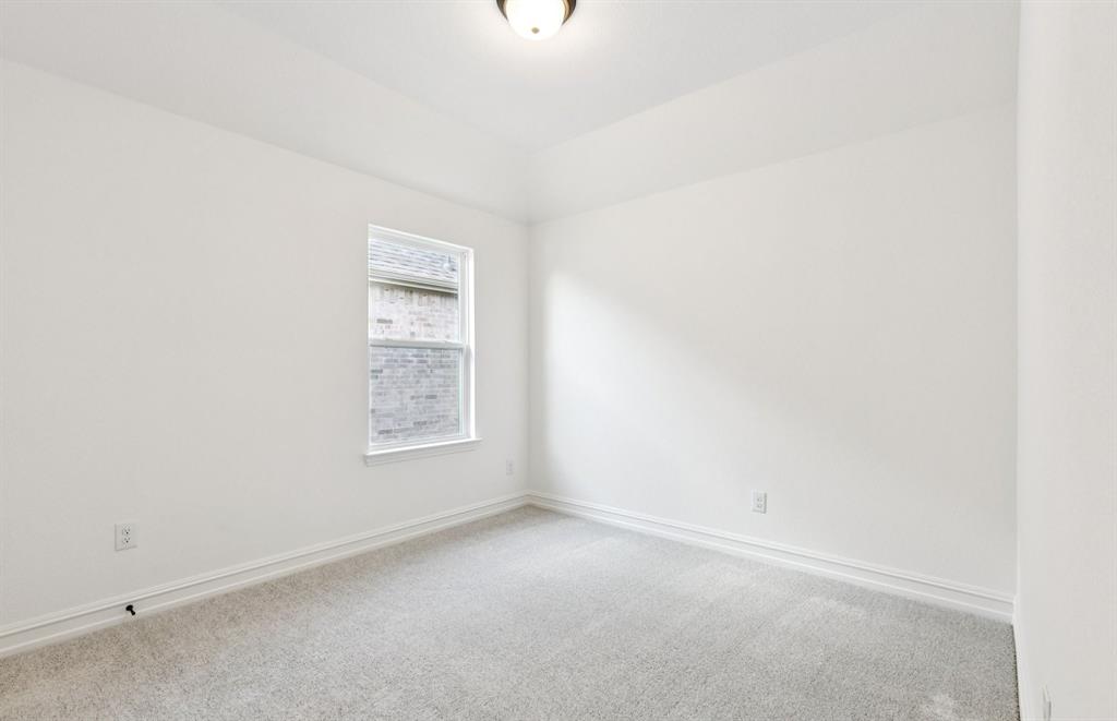 304 Brookhurst Road Little Elm, TX 75068 - Photo 15 of 22 a view of an empty room with a window