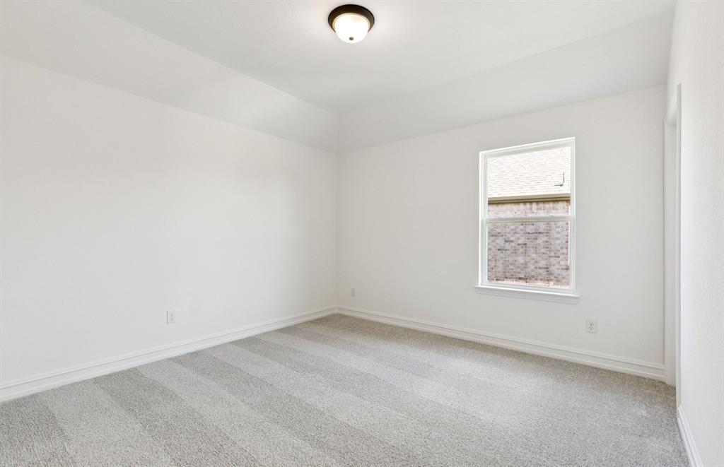 304 Brookhurst Road Little Elm, TX 75068 - Photo 17 of 22 an empty room with a window