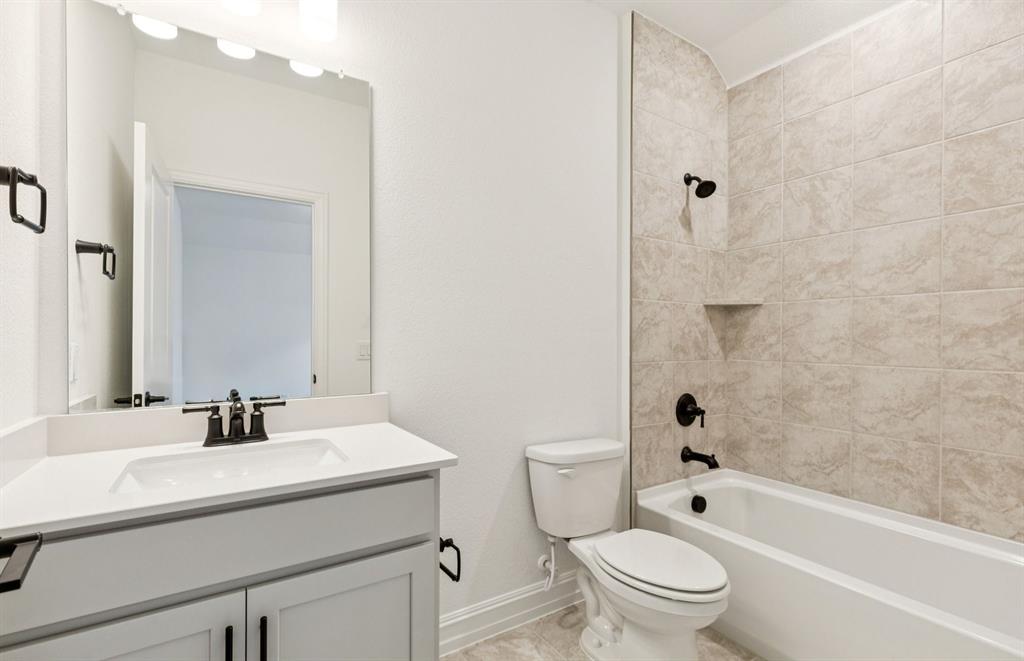 304 Brookhurst Road Little Elm, TX 75068 - Photo 20 of 22 a bathroom with a sink toilet and shower