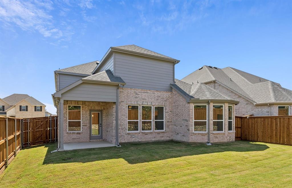 304 Brookhurst Road Little Elm, TX 75068 - Photo 22 of 22 a front view of a house with a yard