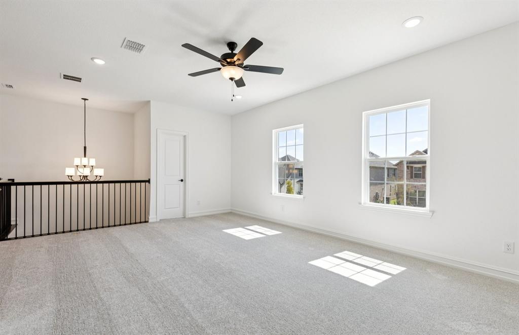 304 Brookhurst Road Little Elm, TX 75068 - Photo 9 of 22 a view of an empty room with a window