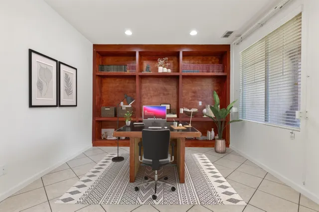 a view of a workspace with furniture