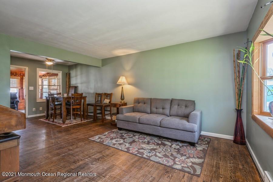 665 Aldrich Road Howell, NJ 07731 - Photo 3 of 23 a living room with furniture and wooden floor