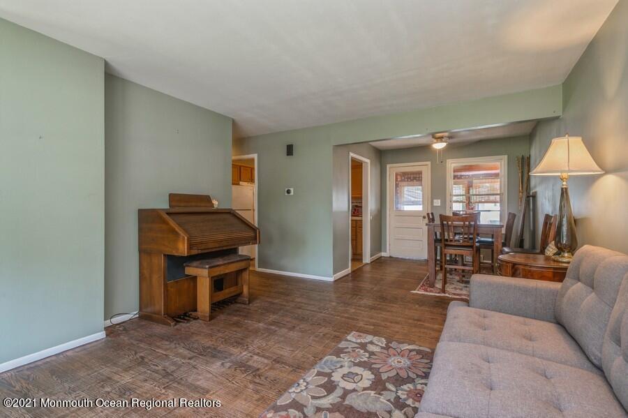 665 Aldrich Road Howell, NJ 07731 - Photo 4 of 23 a living room with furniture a lamp and a window