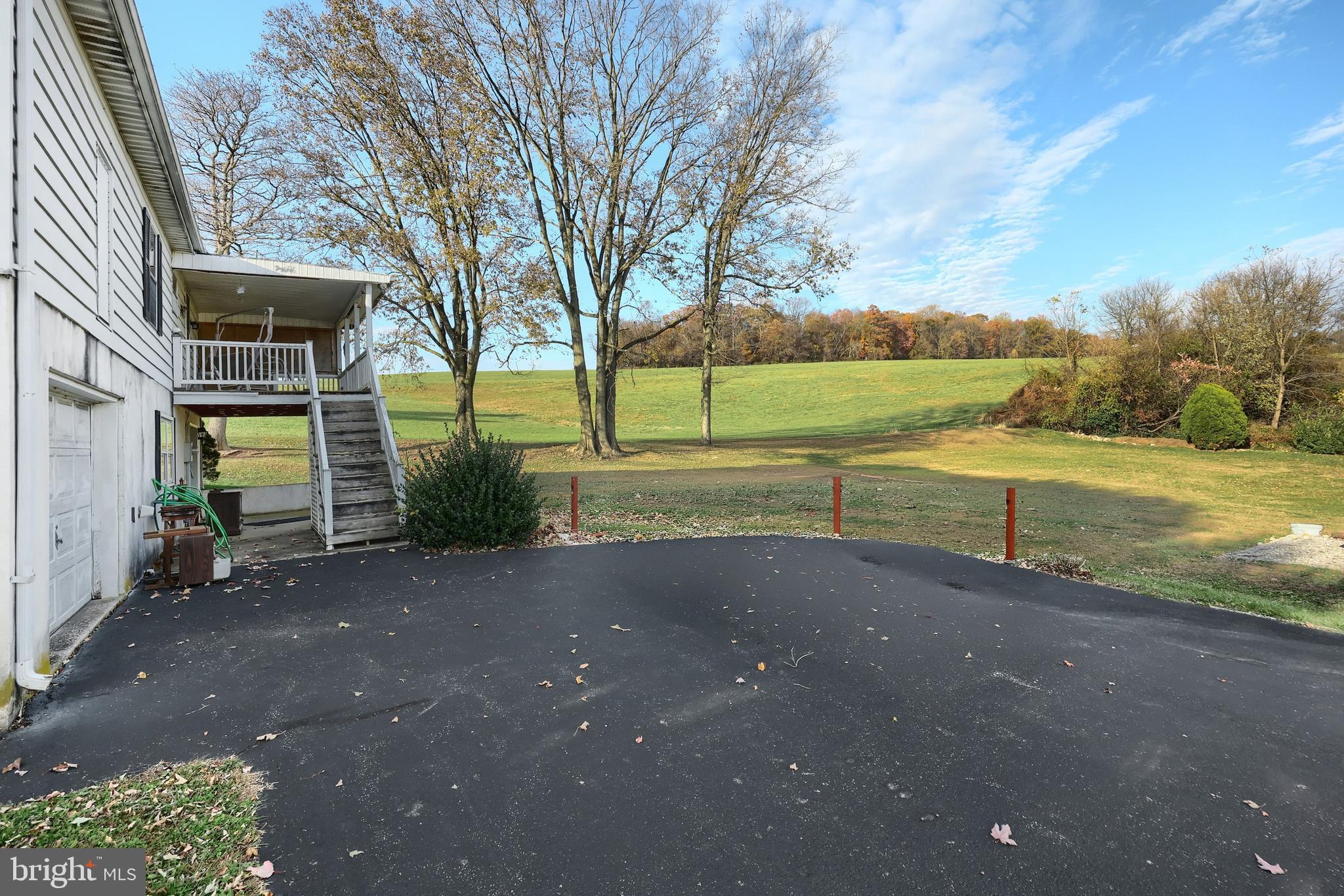 2121 Stauffer Road Seven Valleys, PA 17360 - Photo 3 of 47 a view of a road with a yard
