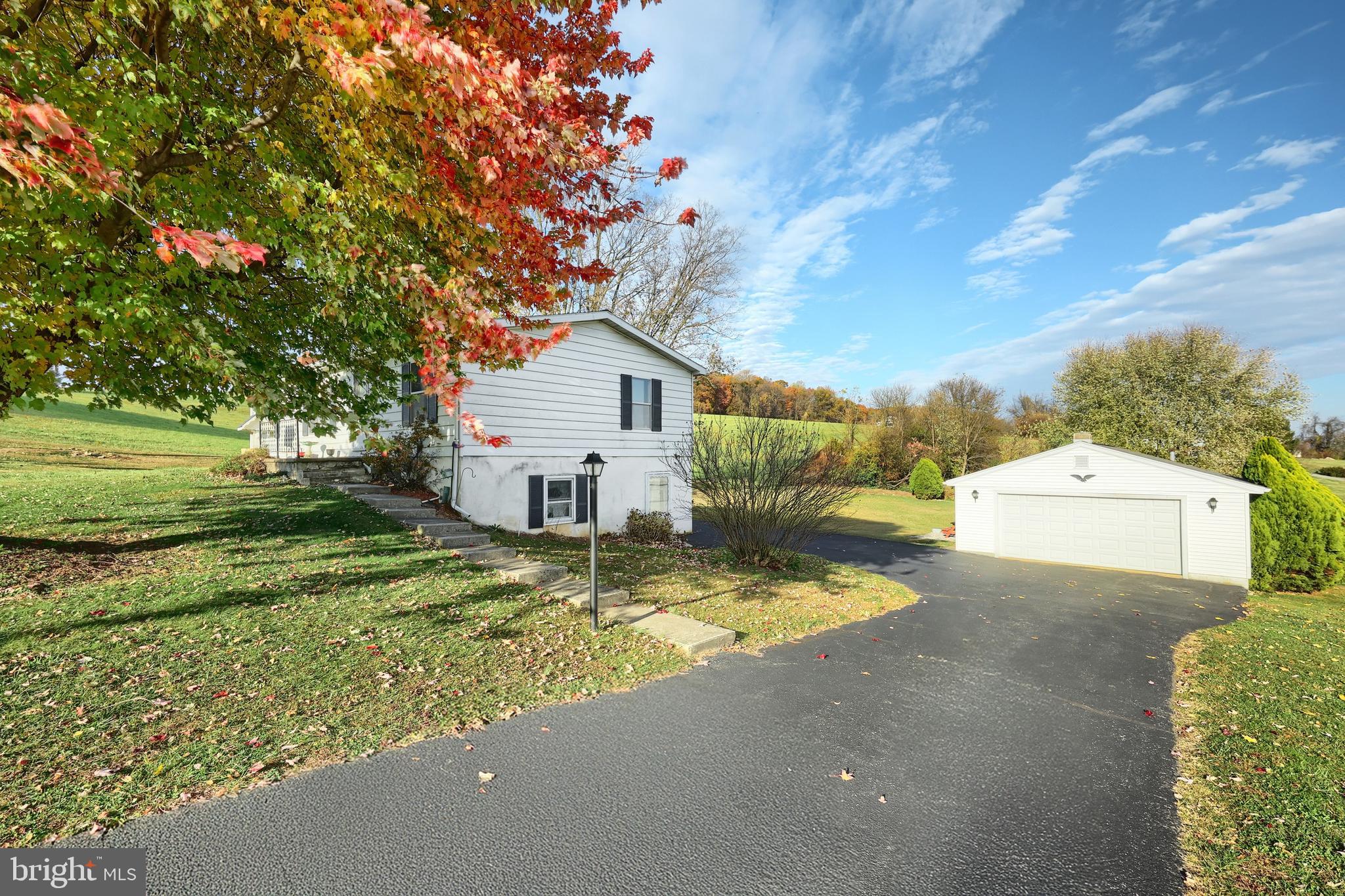 2121 Stauffer Road Seven Valleys, PA 17360 - Photo 8 of 47 a view of a house with a yard and garage