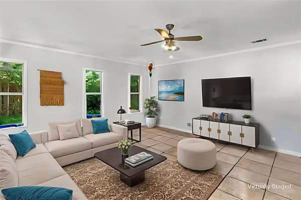 a living room with furniture and a flat screen tv