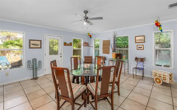 a view of a dining room with furniture window and outside view