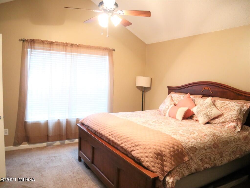 204 Autumn Ridge Court Gray, GA 31032 - Photo 11 of 20 a bedroom with a bed and a chandelier