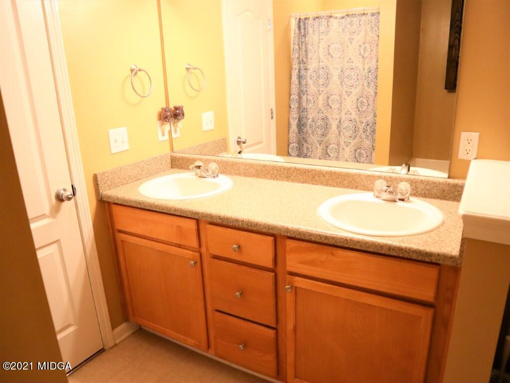 204 Autumn Ridge Court Gray, GA 31032 - Photo 12 of 20 a bathroom with a sink and a mirror