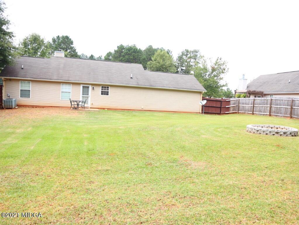 204 Autumn Ridge Court Gray, GA 31032 - Photo 17 of 20 a view of a swimming pool with an outdoor space and seating area