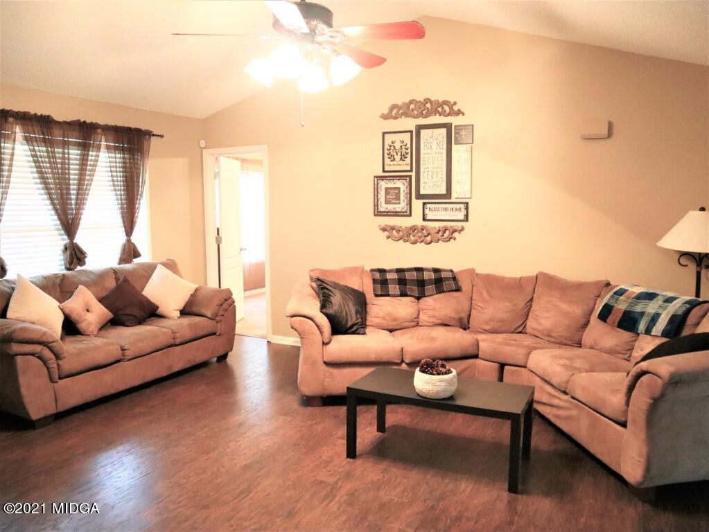 204 Autumn Ridge Court Gray, GA 31032 - Photo 5 of 20 a living room with furniture and a large window