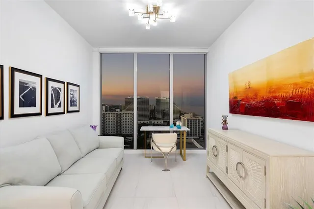 a bed room with a bed and a television