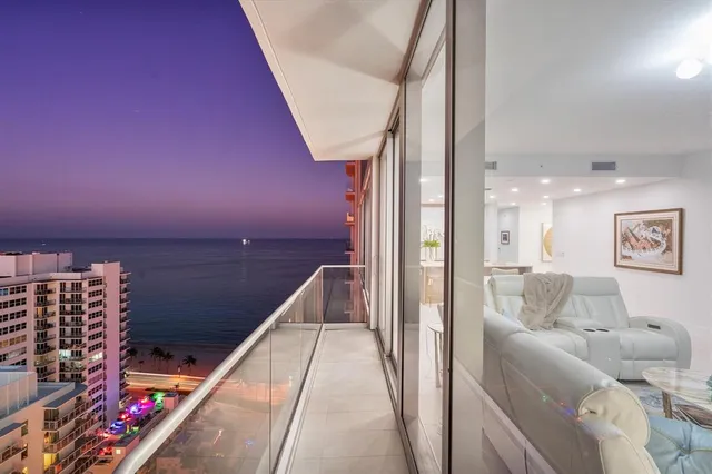 a bedroom with a bed and painting on the wall