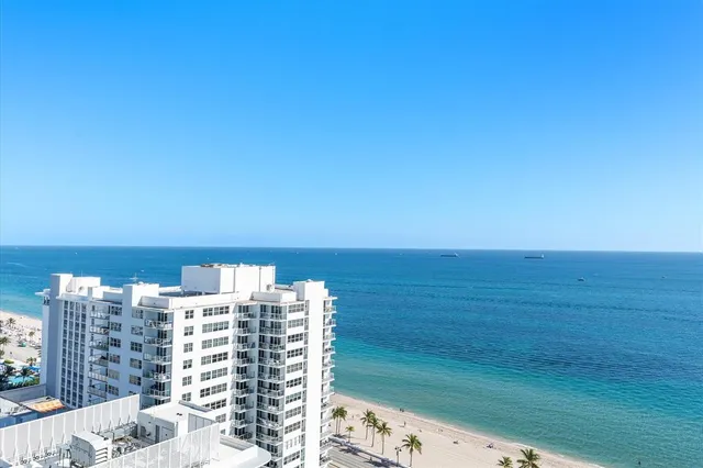 a view of a patio with couches and potted plants