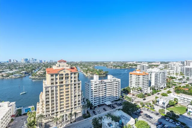 a large living room with furniture fireplace and a large window