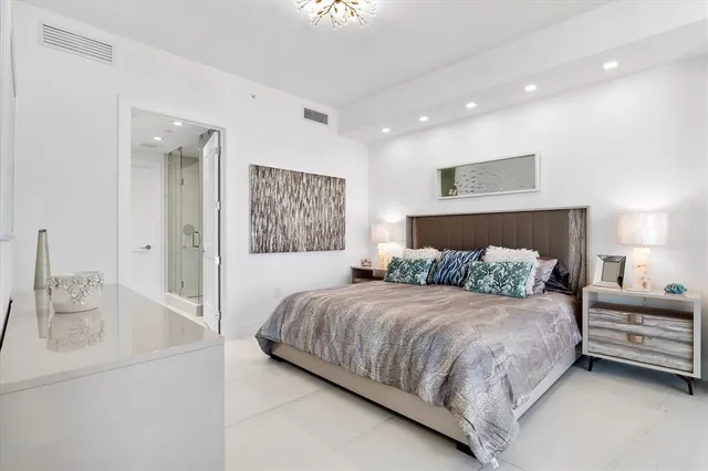 a view of a house with floor to ceiling windows and a table