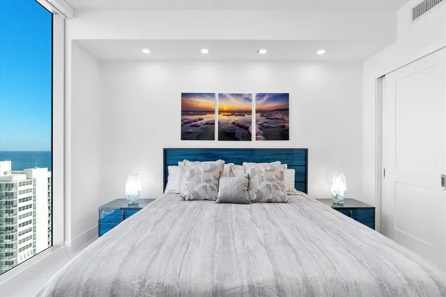 a view of a lake with boats and trees in the background