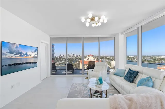 a bedroom with a large bed and a lamp on table