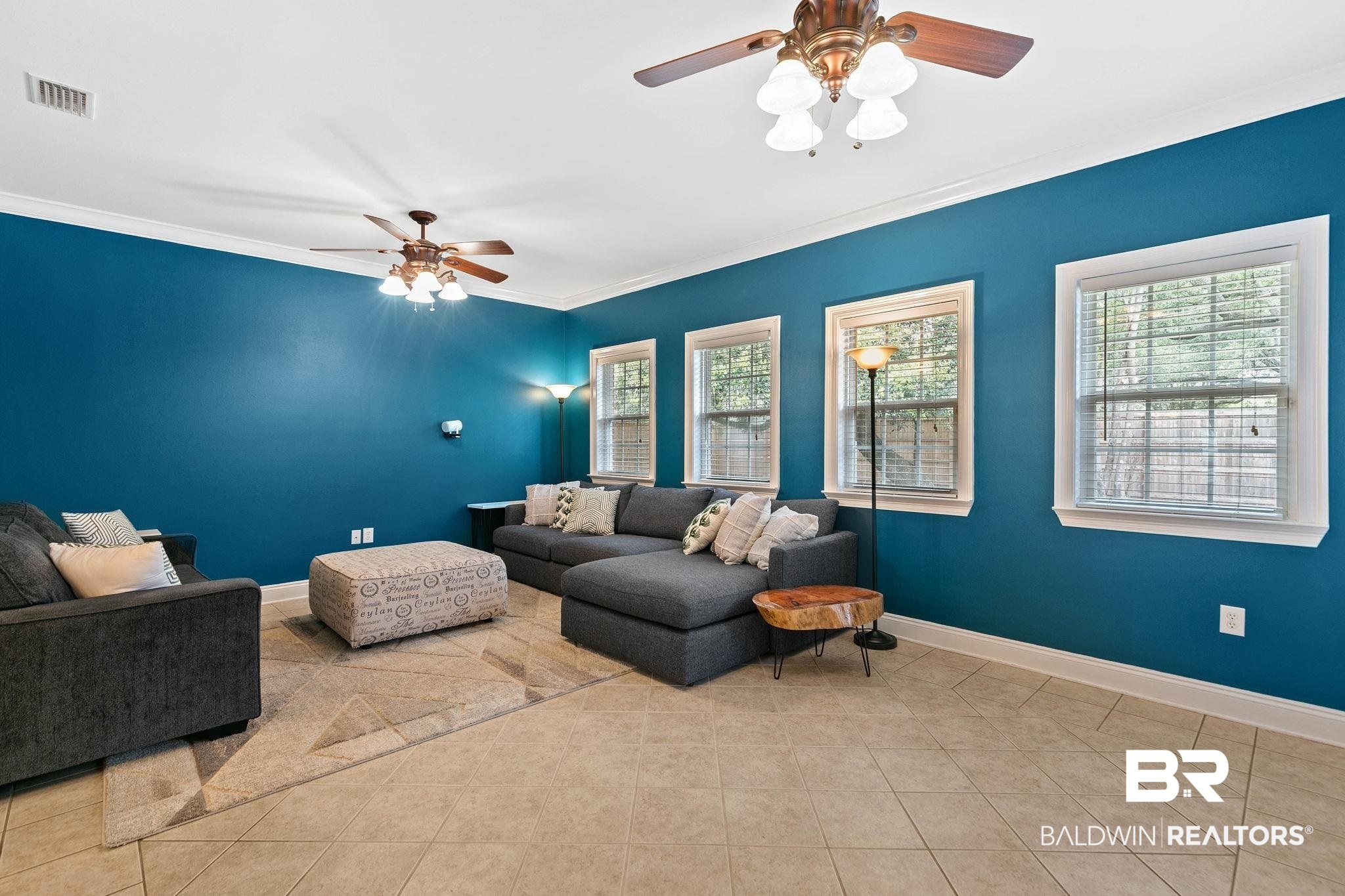 3668 Claridge Road North Mobile, AL 36608 - Photo 46 of 100 Living room featuring a ceiling fan, ornamental molding, and light tile patterned flooring