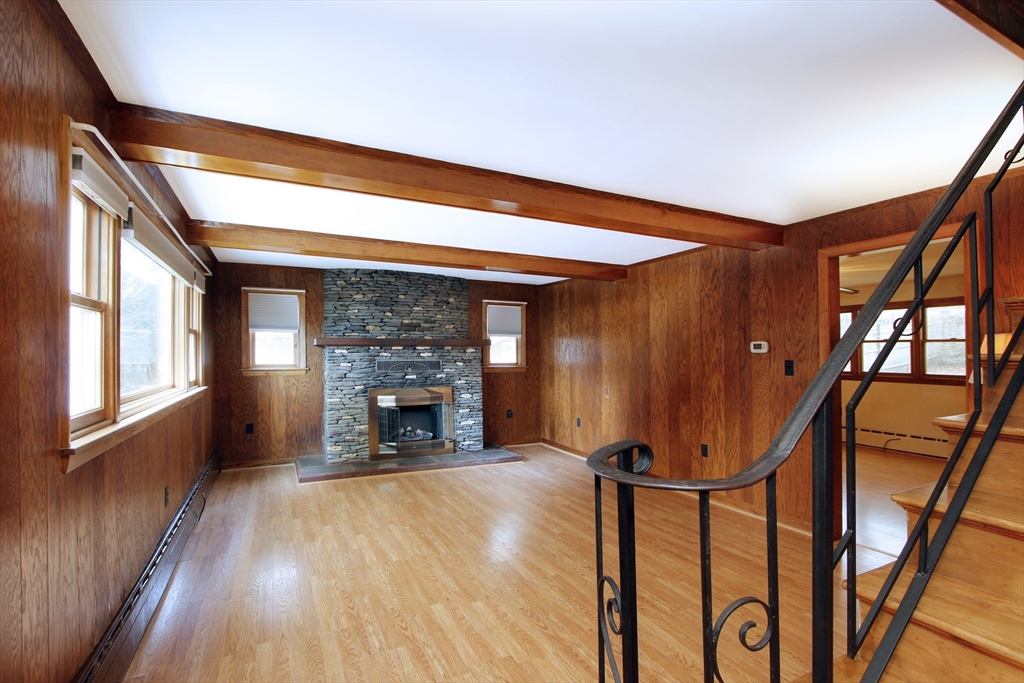 4 Van Bummel Road Bourne, MA 02532 - Photo 11 of 25 a view of an empty room with a fireplace and a window