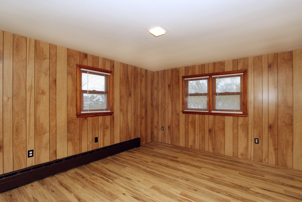 4 Van Bummel Road Bourne, MA 02532 - Photo 16 of 25 a view of empty room with wooden floor and fan
