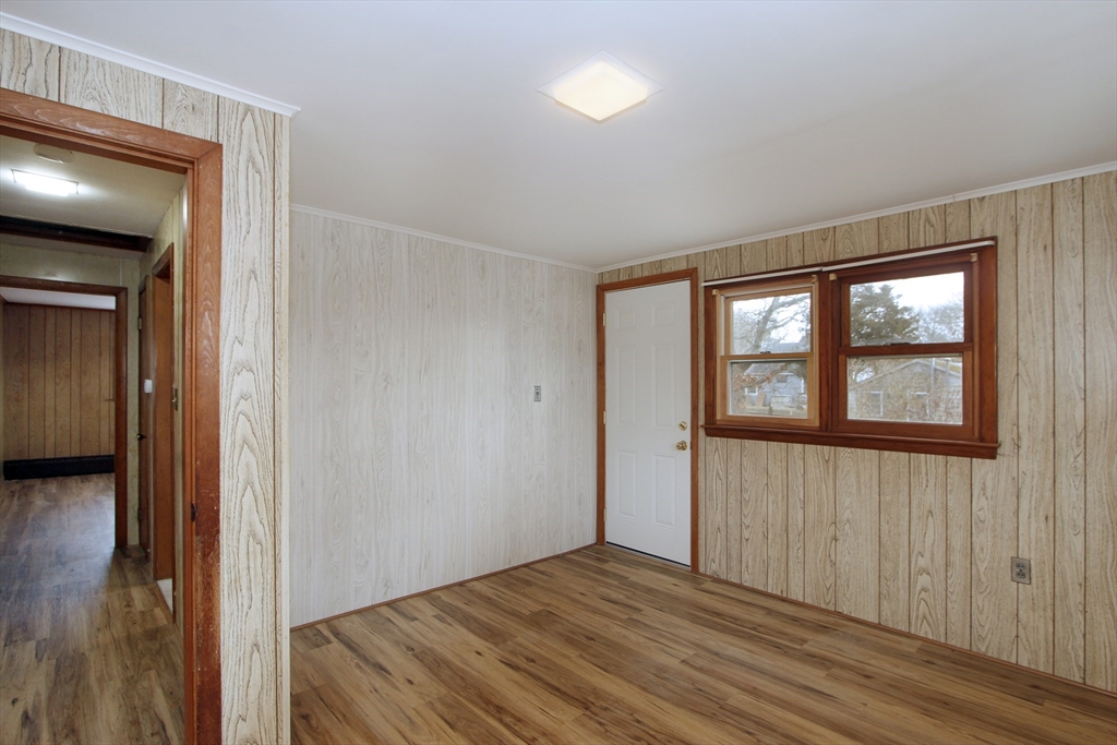 4 Van Bummel Road Bourne, MA 02532 - Photo 17 of 25 a view of empty room with wooden floor and fan