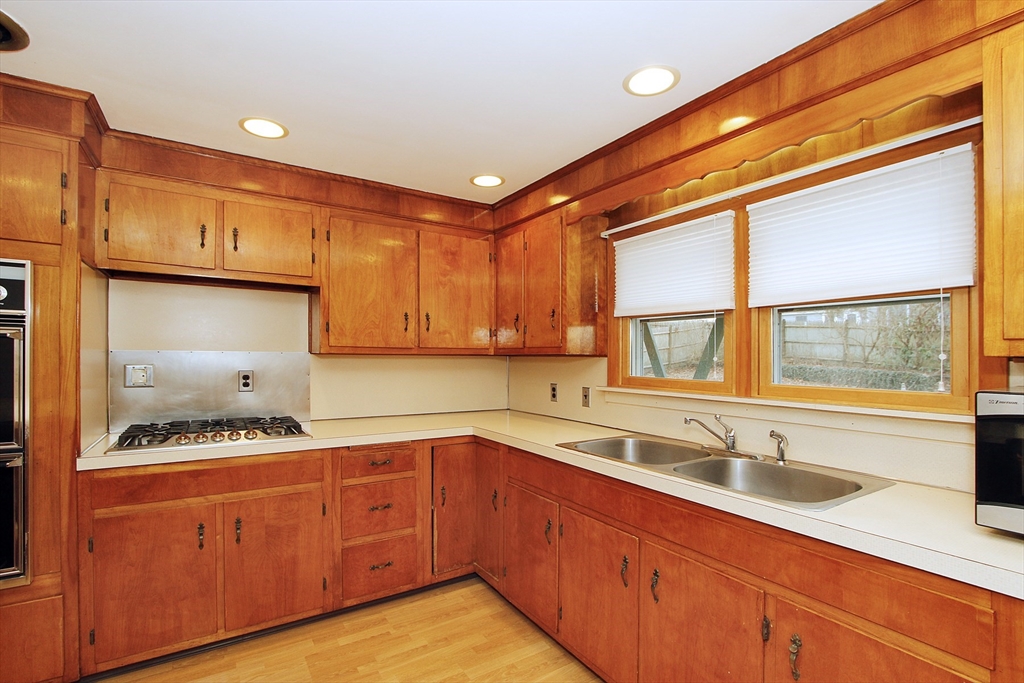 4 Van Bummel Road Bourne, MA 02532 - Photo 10 of 25 a kitchen that has a sink and a stove