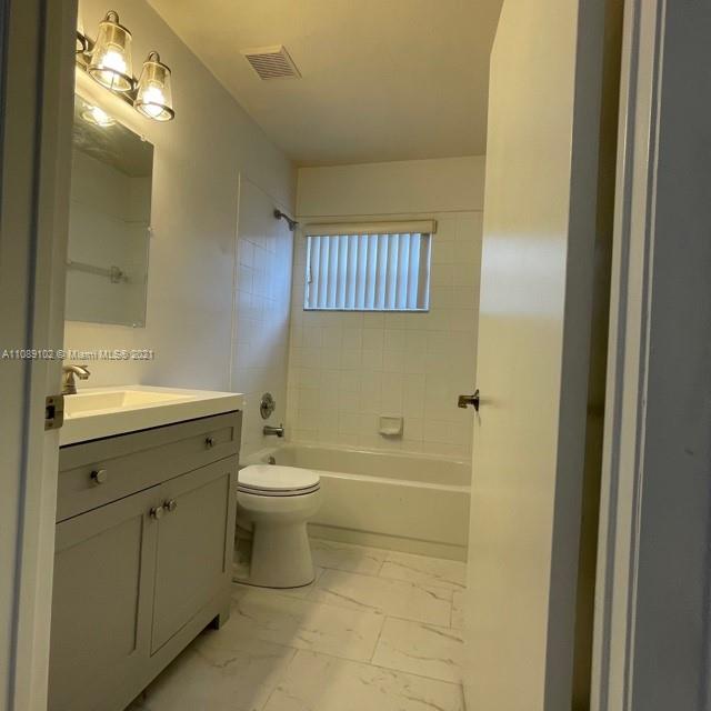 Silver Lakes Pembroke Pines, FL 33029 - Photo 14 of 19 a bathroom with a sink a toilet and shower