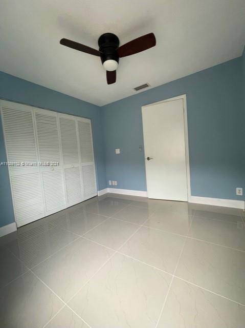 Silver Lakes Pembroke Pines, FL 33029 - Photo 15 of 19 an empty room with a empty space and a ceiling fan