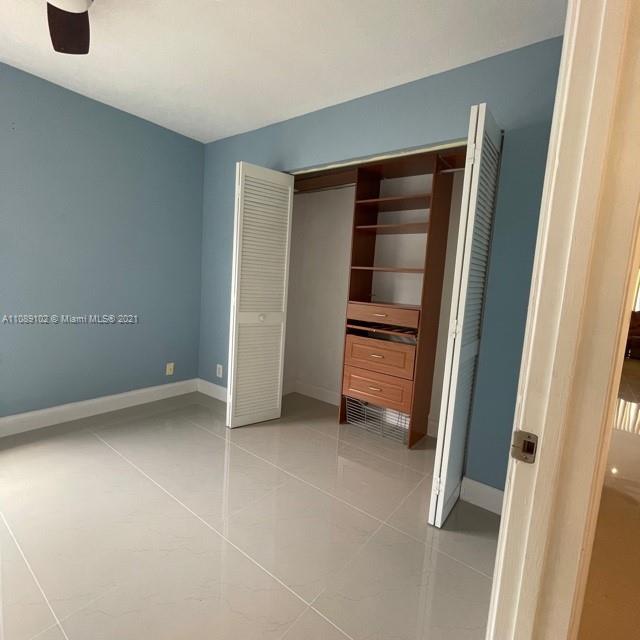 Silver Lakes Pembroke Pines, FL 33029 - Photo 17 of 19 an empty room with closet and mirror