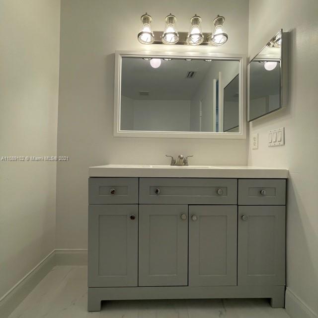 Silver Lakes Pembroke Pines, FL 33029 - Photo 19 of 19 a bathroom with a sink and a mirror