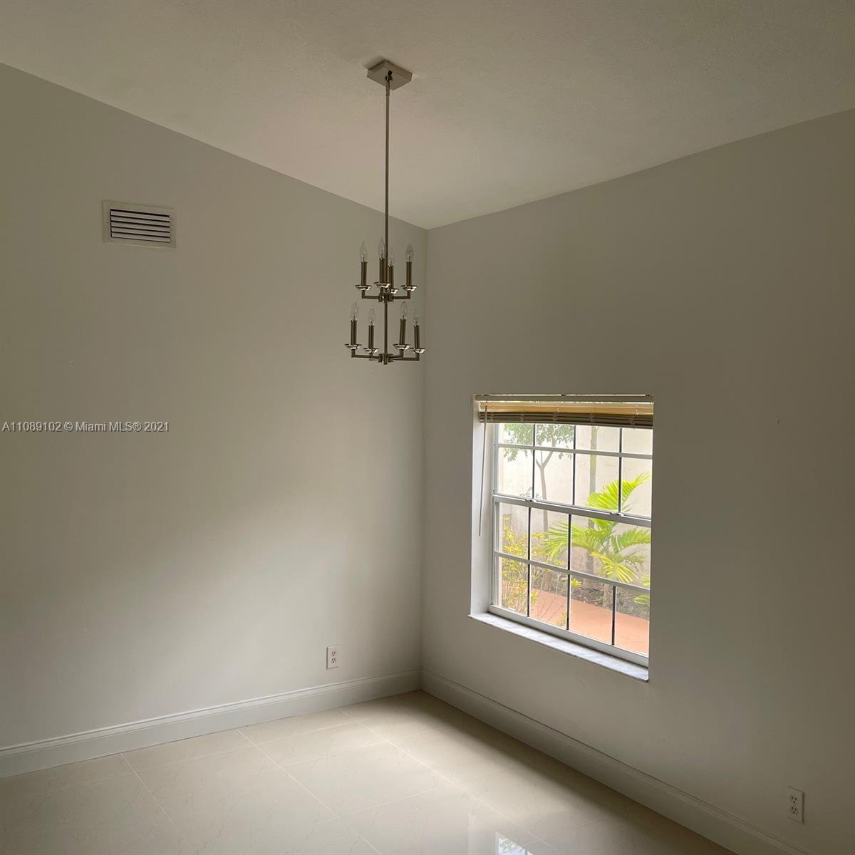 Silver Lakes Pembroke Pines, FL 33029 - Photo 4 of 19 a view of an empty room with a window