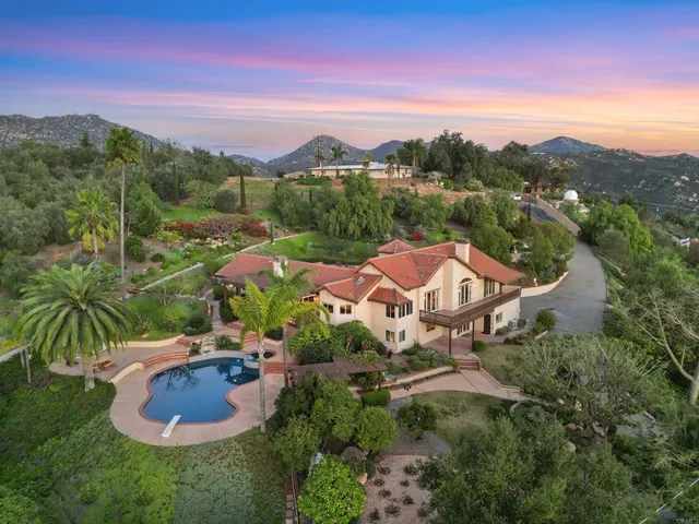 an aerial view of a house with a garden