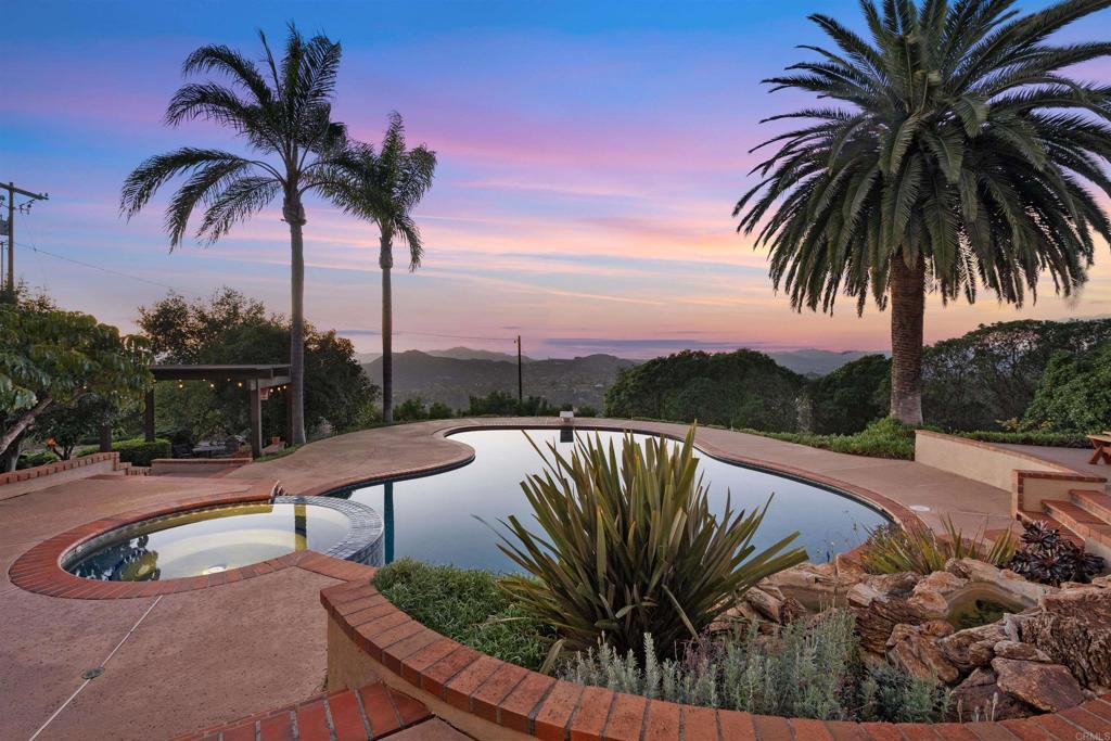 15466 Markar Road Poway, CA 92064 - Photo 4 of 69 a view of swimming pool with a table and chairs