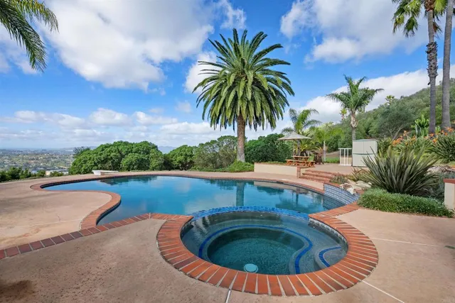 an outdoor view with swimming pool and seating