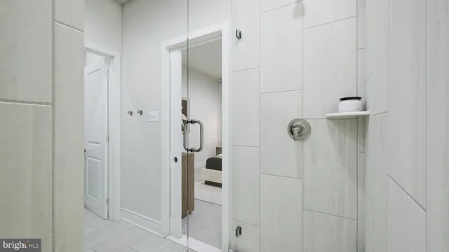 a bathroom with a glass shower door