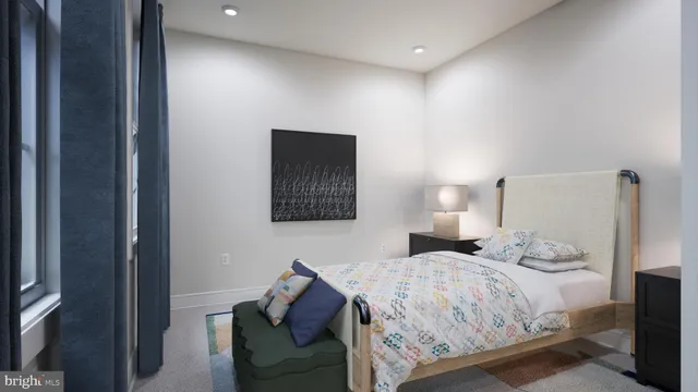 a bedroom with a bed and a couch