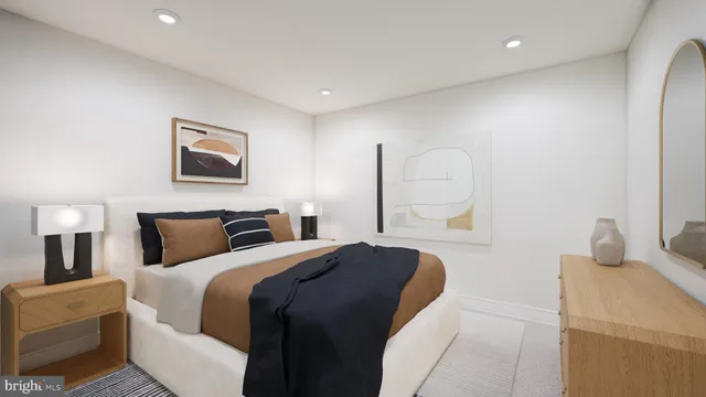 a bedroom with a bed and a painting on the wall