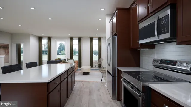 a kitchen with stainless steel appliances granite countertop a sink a stove and a refrigerator