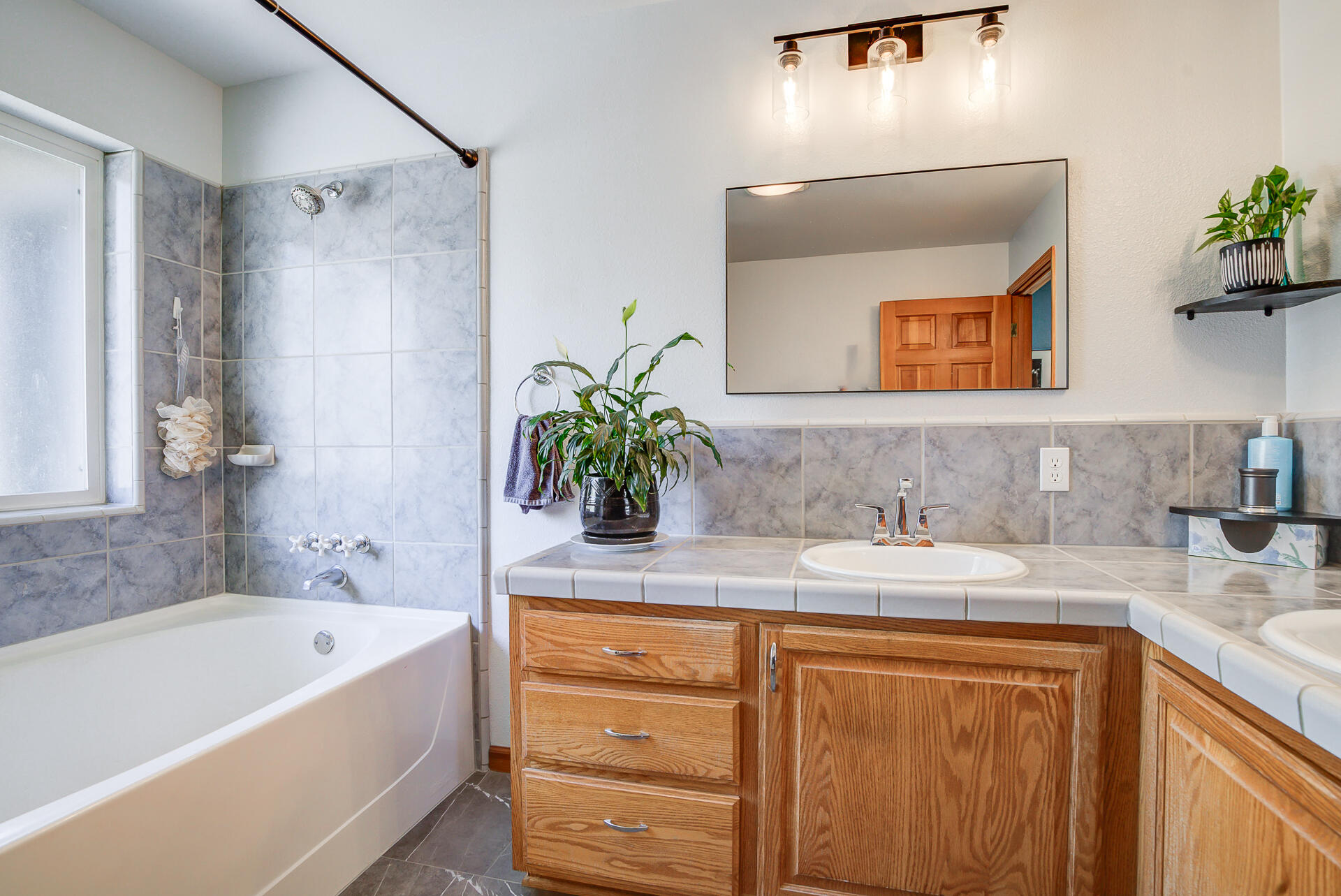 17536 Oly Way Anderson, CA 96007 - Photo 29 of 51 a bathroom with a granite countertop sink mirror and a bathtub
